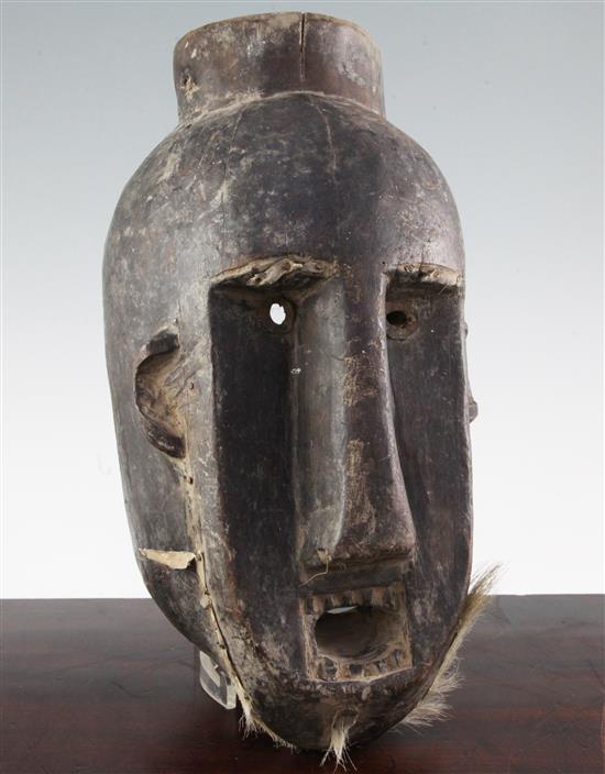 A West African carved hardwood wall mask, 15in.